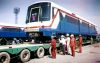 Bangkok_Mass_Transist_System_(Skytrain)3_rolling_over_train_to_hydraulic_trailer.JPG